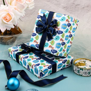 Cartoon music themed gift wrapping paper with dark blue ribbon for birthday presents