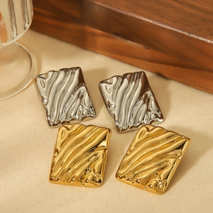 Square wavy earrings in gold and silver finish with liquid metal texture on fabric