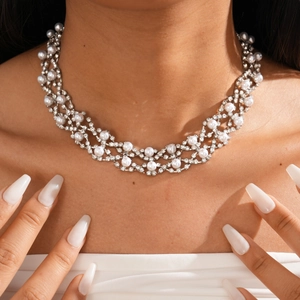 Close-up of double-layer choker with white pearls and sparkling diamonds on a model