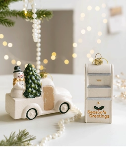Detail of Christmas resin truck with snowman and mailbox with Season's Greetings text
