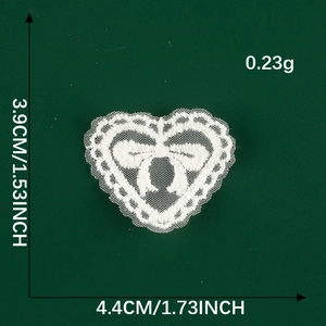 Detailed size view of white heart lace patch with bow embroidery for DIY sewing projects