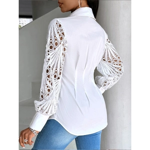 Detail of elegant white shirt showing lace patchwork long sleeves and slim fit design