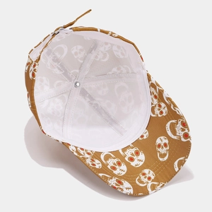 Detail view of the breathable white mesh lining and skull print on a brown baseball cap