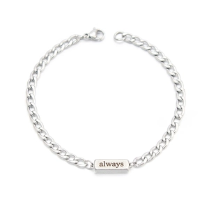 Close-up of silver stainless steel chain bracelet featuring an engraved always plaque