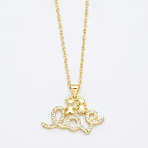 Minimalist gold LOVE necklace with cartoon couple figures and sparkling crystal accents