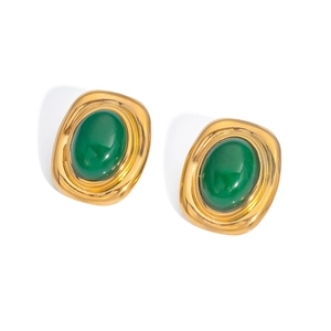 Detailed macro view of vintage gold square earrings with inlaid green oval stones
