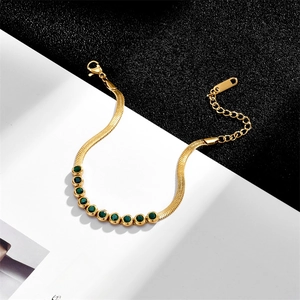 Elegant gold snake chain bracelet featuring nine inlaid green round gemstones