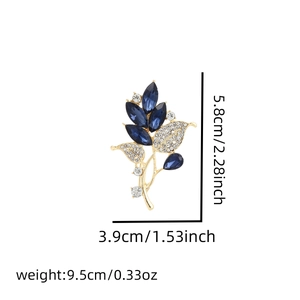 Detail showing dimensions of golden leaf brooch with blue crystals and sparkling rhinestones