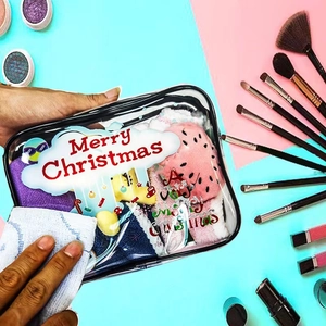 Waterproof PVC Christmas makeup bag detail showing easy cleaning with a white cloth