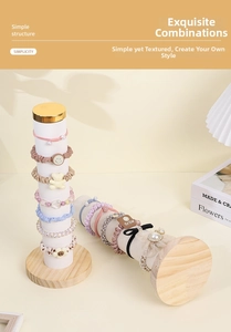 Macro shot of assorted scrunchies and hair ties displayed on white velvet storage pillars