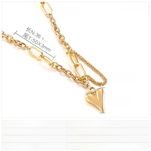 Detail view of golden heart pendant necklace with dimensions and chain width specifications