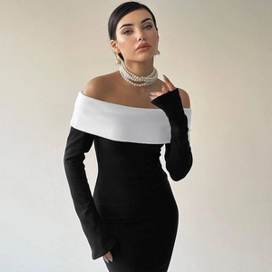 Detail view of a slim-fit off-shoulder dress with black and white color-block layers