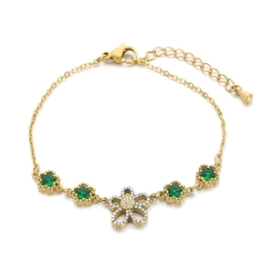 Gold stainless steel bracelet featuring green star charms and a zircon flower pendant