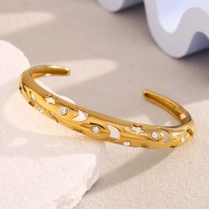 Detail of 18K gold plated celestial star bangle with sparkling zircon stones