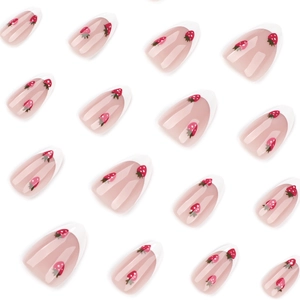 French tip almond press-on nails with white borders and cute strawberry patterns