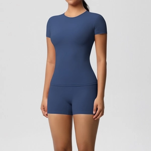 Detail of slim fit navy blue yoga set with high stretch t-shirt and athletic shorts