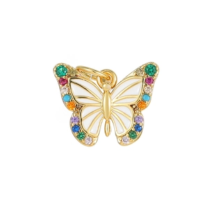 Golden butterfly pendant with colorful zircon stones and white enamel on white background