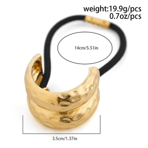 Detail of gold metal hair cuff with hammered texture and black elastic band dimensions