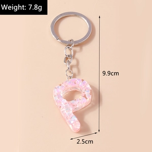 Pink glitter letter P keychain showing dimensions of 9.9cm length and 7.8g weight