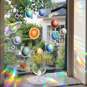 Solar system planet window stickers with rainbow prism effect and sunlight shadows