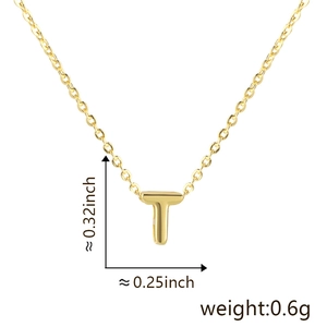 Detailed view of golden letter T pendant with size 0.32x0.25 inch and 0.6g weight