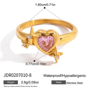 Detail of 18K gold stainless steel ring with pink heart zircon and star accents