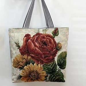 Close-up of floral tapestry canvas tote featuring red roses and yellow sunflowers