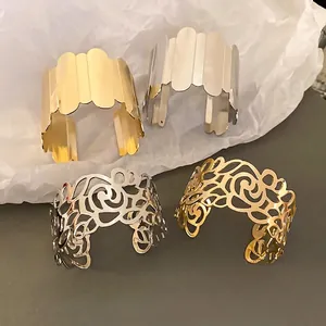 Geometric patterned metal open cuffs in gold and silver with hollow floral and wavy designs