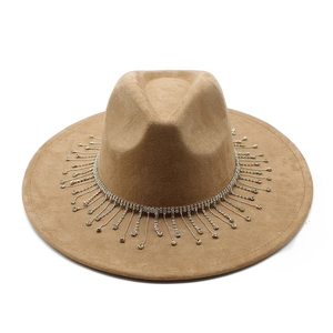 Detailed view of camel suede felt bridal hat with sparkling rhinestone fringe tassels