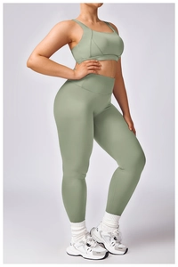 Detail of sage green sports bra and high-waist yoga leggings set with supportive fit