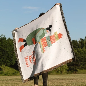 Detailed knit blanket with colorful tassels featuring a festive Happy New Year girl design