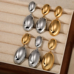 Polished stainless steel water drop earrings in gold and silver finish set in a wooden box