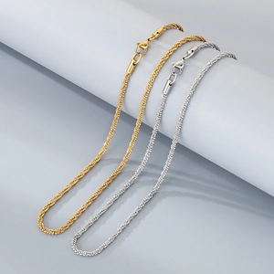 Close-up of gold and silver twisted rope necklaces with lobster clasps in stainless steel