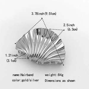 Detailed view of large shell hair claw clip with dimensions and 84g weight marking