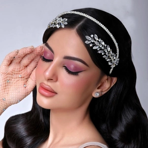 Close-up of bridal crystal leaf headband with silver rhinestones on model for weddings