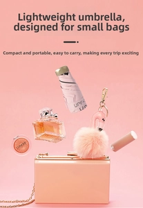 Pink mini five-fold sun umbrella with UPF 50+ coating next to cosmetics in pink theme