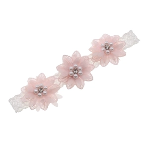Elastic baby headband with three pink chiffon flowers featuring pearls and rhinestones