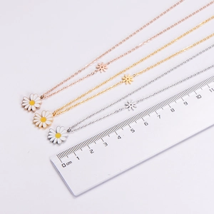 Detailed size view of daisy pendant necklaces in gold, rose gold and silver finishes
