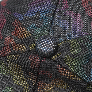 Macro shot of breathable black mesh cap featuring rainbow gradient texture on top