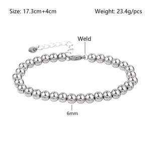 Detail view of 6mm stainless steel bead bracelet with welding process and lobster clasp