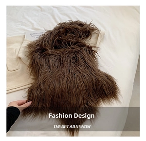Detail view of dark brown faux fur shoulder bag texture on soft white bedding background