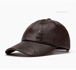 Detail of brown PU leather baseball cap featuring vintage JAMONT and 1985 embossed textures