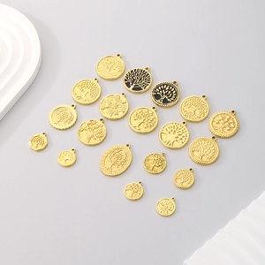 Set of 17 golden Tree of Life pendants in round and oval shapes for jewelry making