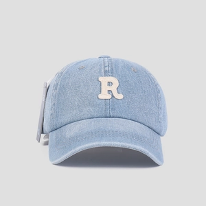 Detail of light blue washed denim baseball cap featuring off-white letter R towel embroidery