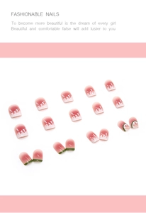 Detail of short watermelon press-on nails with pink gradient and cute summer fruit art