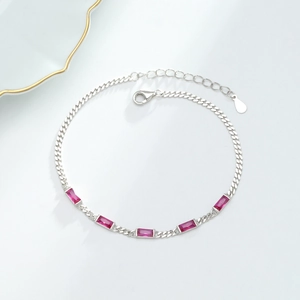 Detailed macro view of S925 silver bracelet with pink cubic zirconia and adjustable chain