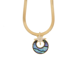 Detail of gold snake chain with abalone shell circle and sparkling star pendant