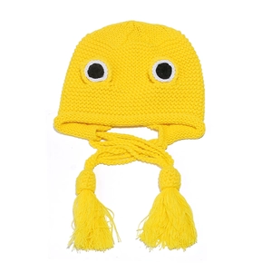 Detailed knit texture of a yellow frog-style beanie with cartoon eyes and long tassels
