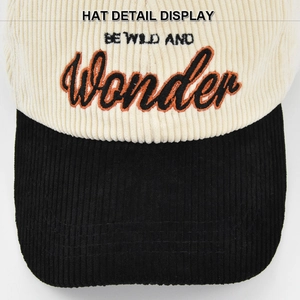 Close-up of BE WILD AND Wonder embroidery on contrast corduroy baseball cap