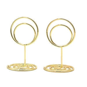 Set of two gold spiral metal place card holders with double circle top for desk display